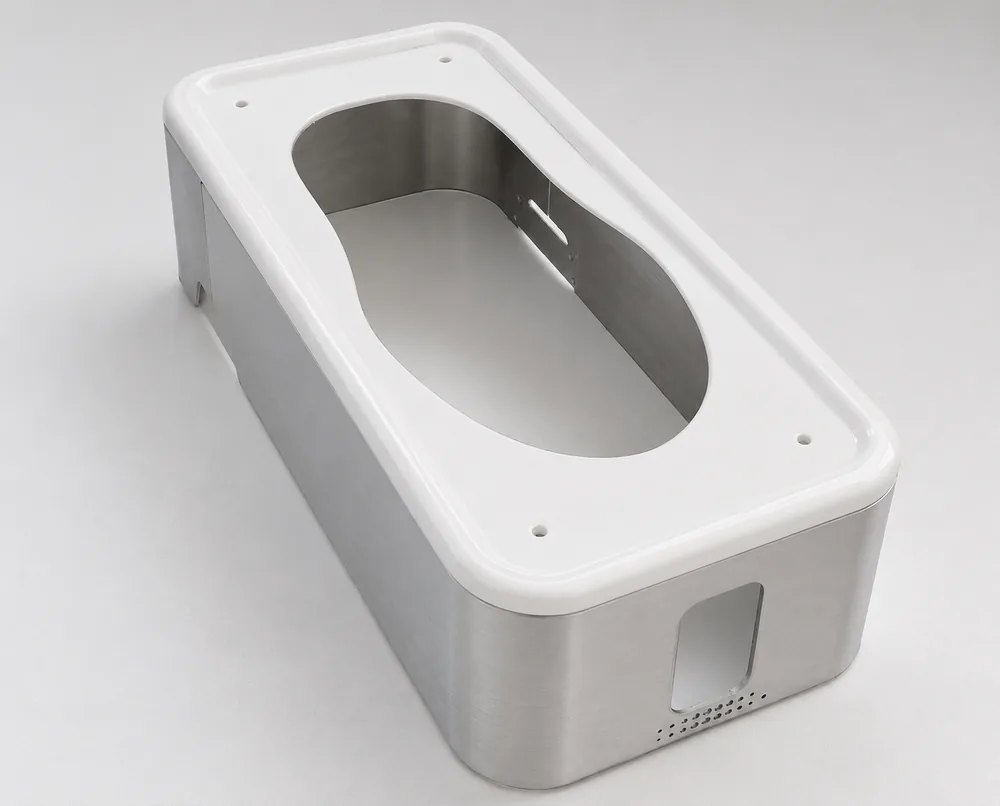 Stainless steel instrument enclosure with a white moulded top bezel and ventilated side panel